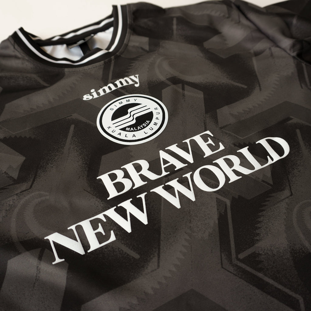 SIMMY black oversized jersey featuring Brave New World text and a circular Kuala Lumpur logo graphic